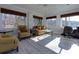 Sunroom with lake view, comfortable seating, and plenty of natural light at 1126 Wedgefield Dr, Marietta, GA 30064