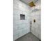 Modern shower with marble-look tile and rainfall shower head at 1331 E Atlanta E Rd, Stockbridge, GA 30281