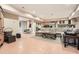 Finished basement with sectional sofa, tile flooring, and kitchenette at 4340 Garmon Nw Rd, Atlanta, GA 30327