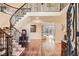 Grand entryway with a curved staircase and hardwood floors at 4340 Garmon Nw Rd, Atlanta, GA 30327
