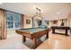 Basement game room with pool table, foosball, and a stained glass light at 4340 Garmon Nw Rd, Atlanta, GA 30327