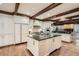 Spacious kitchen with large island, exposed beams and stainless steel appliances at 4340 Garmon Nw Rd, Atlanta, GA 30327