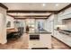 Open kitchen with island, breakfast nook and exposed beams at 4340 Garmon Nw Rd, Atlanta, GA 30327
