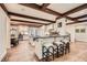 Gourmet kitchen with island, exposed beams, and stainless steel appliances at 4340 Garmon Nw Rd, Atlanta, GA 30327