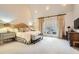 Luxurious main bedroom with plush bedding and access to a private balcony at 4340 Garmon Nw Rd, Atlanta, GA 30327