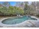 Freeform swimming pool with flagstone decking at 4340 Garmon Nw Rd, Atlanta, GA 30327