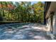 In-ground pool and patio area next to home at 5109 Cherry Ln, Powder Springs, GA 30127