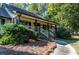 House exterior with stone accents and covered porch at 5109 Cherry Ln, Powder Springs, GA 30127