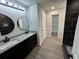 Elegant bathroom featuring double vanity and gray flooring at 1341 E Atlanta E Rd, Stockbridge, GA 30281