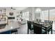 Open dining area with modern table and chairs, next to the kitchen at 2127 Nichols Ln, Decatur, GA 30032