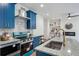Modern kitchen with blue cabinets, granite countertops, and stainless steel appliances at 2127 Nichols Ln, Decatur, GA 30032