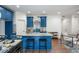 Modern kitchen with blue cabinets, granite countertops, and stainless steel appliances at 2127 Nichols Ln, Decatur, GA 30032