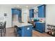 Modern kitchen with blue cabinets, granite countertops, and stainless steel appliances at 2127 Nichols Ln, Decatur, GA 30032