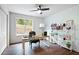 Home office with hardwood floors, built-in shelving, and large window at 2127 Nichols Ln, Decatur, GA 30032