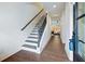 Modern staircase with dark wood treads and metal railing at 2127 Nichols Ln, Decatur, GA 30032
