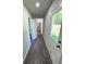 Bright hallway with LVT flooring and doors to other rooms at 1351 E Atlanta E Rd, Stockbridge, GA 30281