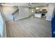 Open living space with LVT flooring and a view into the kitchen at 1351 E Atlanta E Rd, Stockbridge, GA 30281