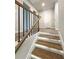 Modern staircase with wood and metal accents at 1351 E Atlanta E Rd, Stockbridge, GA 30281