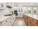 Bright kitchen with white cabinets, quartz countertops, and a gas cooktop at 2719 Byess Ct, Marietta, GA 30064