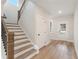 Elegant staircase with wooden railings and neutral tones at 2719 Byess Ct, Marietta, GA 30064