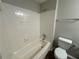 Full bathroom with shower/tub and tile surround at 5464 Martins Crossing Rd, Stone Mountain, GA 30088