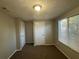 Simple bedroom with carpet and neutral wall colors at 5464 Martins Crossing Rd, Stone Mountain, GA 30088