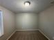 Simple bedroom with neutral walls and carpet at 5464 Martins Crossing Rd, Stone Mountain, GA 30088