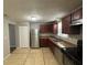 Modern kitchen with stainless steel appliances and wood cabinets at 5464 Martins Crossing Rd, Stone Mountain, GA 30088