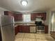 Modern kitchen with stainless steel appliances and wood cabinets at 5464 Martins Crossing Rd, Stone Mountain, GA 30088