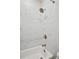 Bright bathroom featuring tile surround in shower with white tub at 290 Walker Ave, Alpharetta, GA 30076