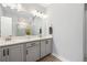 Bathroom features a double sink vanity, modern lighting fixtures, and stylish decor at 290 Walker Ave, Alpharetta, GA 30076