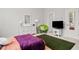 Large bedroom with a large area rug, decor, and ample natural light at 290 Walker Ave, Alpharetta, GA 30076