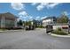 Community entrance featuring stone gateposts, landscaping, and secure access for residents at 290 Walker Ave, Alpharetta, GA 30076