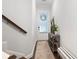 Bright entryway features a stylish table, decor, and access to the staircase at 290 Walker Ave, Alpharetta, GA 30076