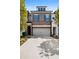 Two-story townhome with gray siding, brick accents, and a two-car garage at 290 Walker Ave, Alpharetta, GA 30076