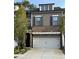 Attractive two-story home boasts a brick facade, grey siding, and a two-car garage at 290 Walker Ave, Alpharetta, GA 30076