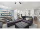 Spacious living room connected to a dining space and kitchen featuring a stylish sofa set and a central ottoman at 290 Walker Ave, Alpharetta, GA 30076