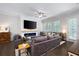 Spacious living room with large TV, modern fireplace, and comfortable seating at 290 Walker Ave, Alpharetta, GA 30076