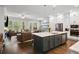 Spacious open-concept design featuring a living room and eat-in kitchen with stainless steel appliances at 290 Walker Ave, Alpharetta, GA 30076