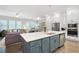 Bright, open-concept kitchen and living room featuring stainless steel appliances and hardwood floors at 290 Walker Ave, Alpharetta, GA 30076