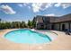 Community swimming pool with clear water, lounge chairs, and a nearby covered lounge area for residents at 290 Walker Ave, Alpharetta, GA 30076