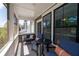 Comfortable seating in the screened-in porch offers a relaxing outdoor retreat with neighborhood views at 290 Walker Ave, Alpharetta, GA 30076