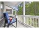 A cozy screened porch with comfortable seating provides a tranquil outdoor living space at 290 Walker Ave, Alpharetta, GA 30076