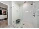 A modern shower with white subway tiles and glass enclosure adjacent to walk-in closet at 290 Walker Ave, Alpharetta, GA 30076
