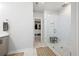 Bathroom featuring a walk-in closet and a modern shower with a glass enclosure and tiled walls at 290 Walker Ave, Alpharetta, GA 30076
