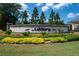 Elegant community entrance sign for 'Ashbury', surrounded by colorful flowers and manicured landscaping at 290 Walker Ave, Alpharetta, GA 30076