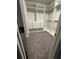 Spacious walk-in closet with custom shelving, drawers, and ample hanging space at 290 Walker Ave, Alpharetta, GA 30076