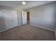 Spacious bedroom with double doors and access to bathroom at 804 Trestle Creek Ct, Temple, GA 30179