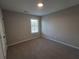 Spacious bedroom with neutral walls and carpet flooring at 804 Trestle Creek Ct, Temple, GA 30179