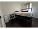 Bedroom with a black platform bed and dark wood floors at 987 Forrest Se Cir, Atlanta, GA 30354